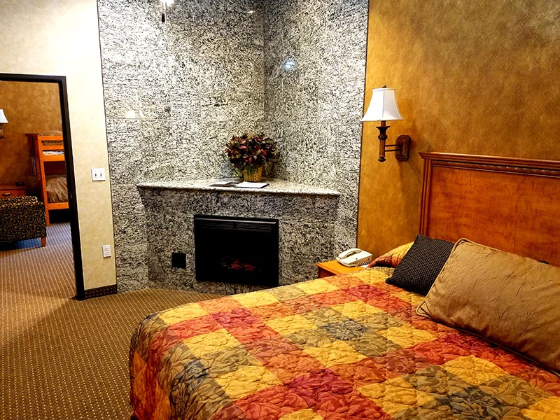 King Luxury Suite bed and fireplace