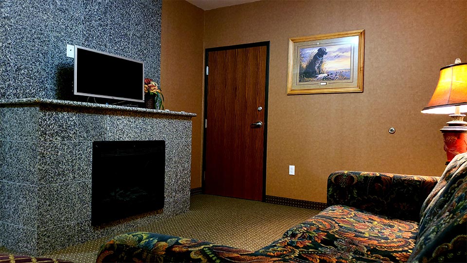ADA Double Queen Suite fireplace and tv