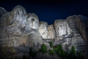 Photo of Mount Rushmore at night.