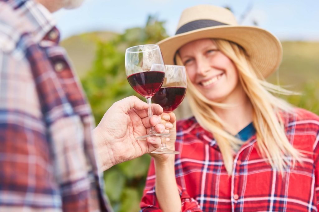 A woman enjoying wine from one of the many wineries in South Dakota.