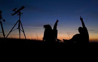 Two people in one of the Best Places To Stargaze in South Dakota.