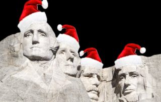 Mount Rushmore with Santa hats on a Christmas Vacation Family.