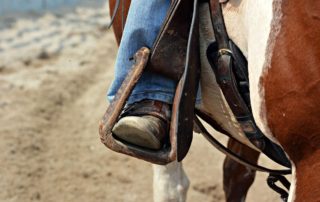 A person Horseback Riding in South Dakota.