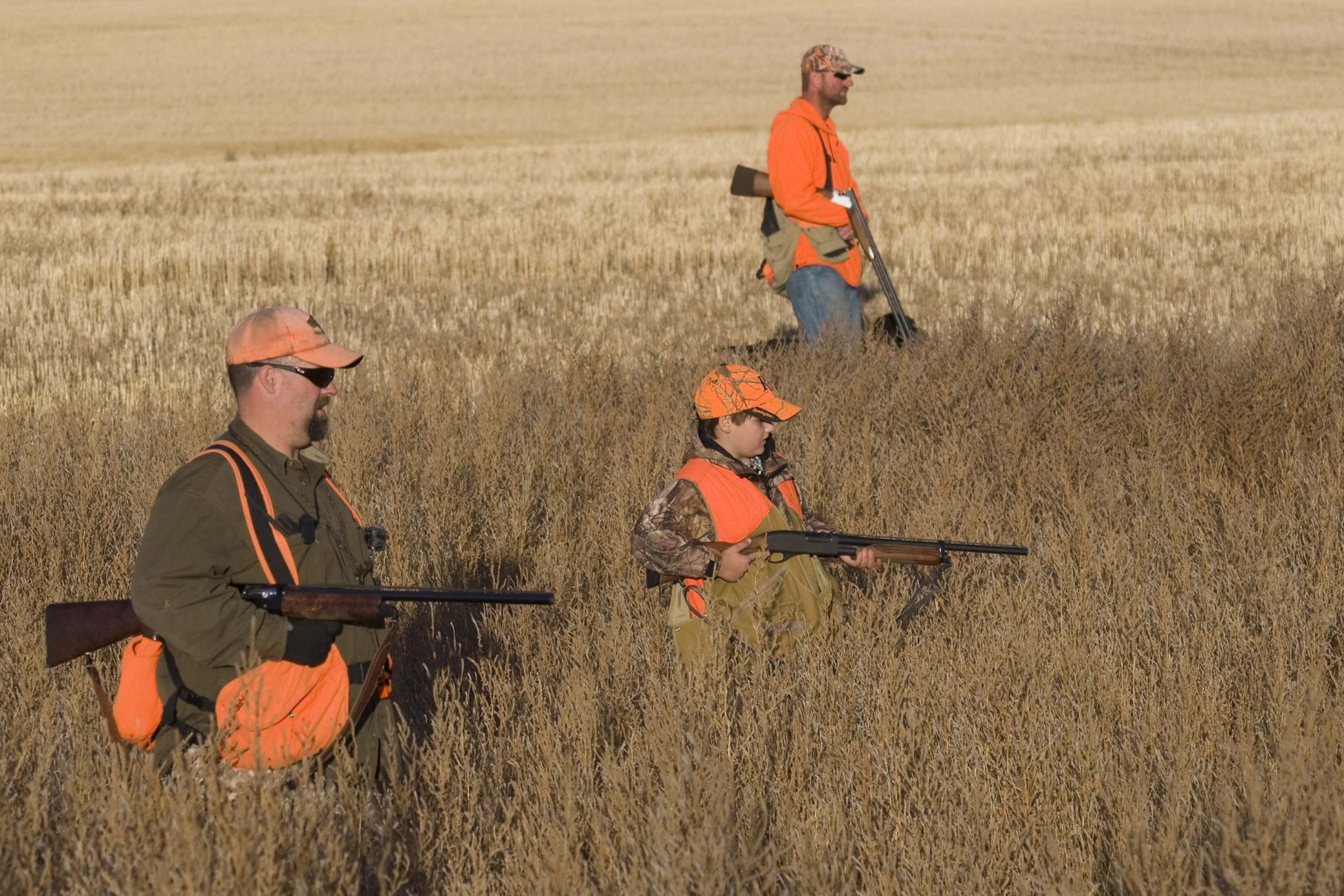 Three men hunting in South Dakota.
